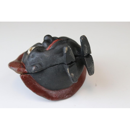 160 - A novelty cast iron money box in the form of a funny man .inscribed Save and Save