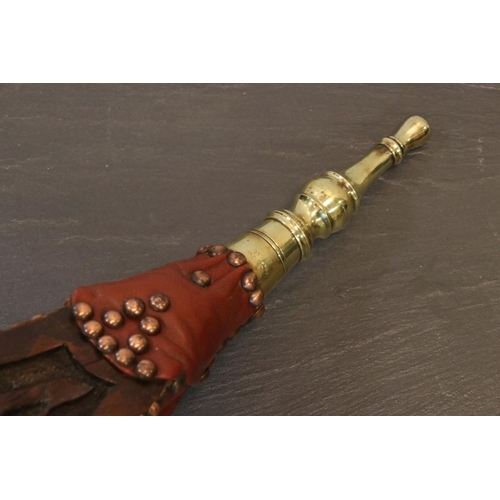 164 - A pair of antique wooden and brass bellows with carved oak leaf decoration.