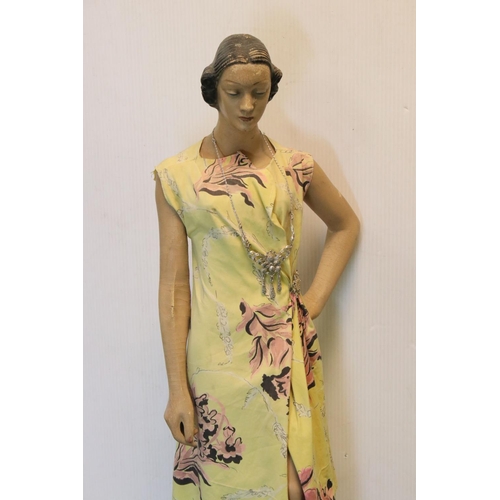 173 - A mid 20th century artist posed model of a lady in dress mounted on plinth.