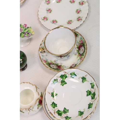 180 - A large box of mixed collectables to include a large quantity of Royal Albert 