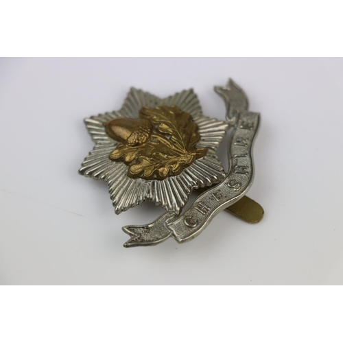 10 - A British The Cheshire Regiment Bi-Metal Cap Badge With Slide Fixing To The Verso.