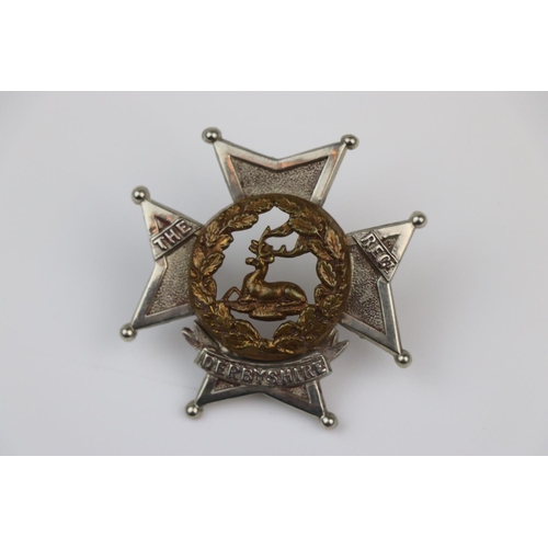 24 - A British The Derbyshire Regiment Bi-Metal Pouch Badge With Twin Loop Fixings To The Verso.