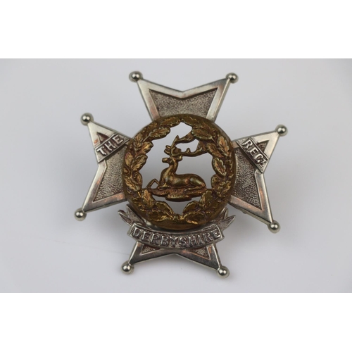 24 - A British The Derbyshire Regiment Bi-Metal Pouch Badge With Twin Loop Fixings To The Verso.