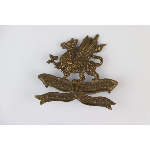 25 - A British The 11th Battalion Of The Border Regiment Brass Cap Badge With Twin Loop Fixings To The Ve... 