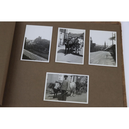 60 - A World War Two German Photograph Album With Contents To Include A Selection Of Photographs Showing ... 