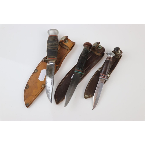 70 - A Collection Of Three Vintage Sheath Knives To Include The Makers William Rodgers And G. Butler & Co... 