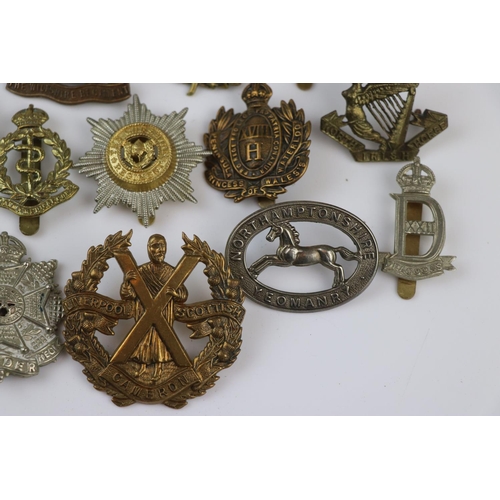 79 - A Collection Of Approx Twenty Five British Military Regimental Cap Badges To Include : The Northampt... 