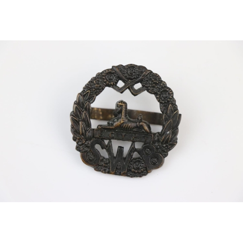 8 - A British South Wales Border Regiment Officers Bronze Cap Badge With Twin Blade Fixings To The Verso... 