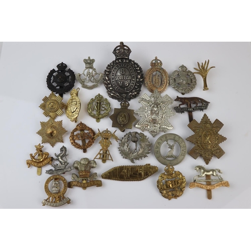 81 - A Collection Of Approx Twenty Five British Military Regimental Cap Badges To Include : The Tank Corp... 