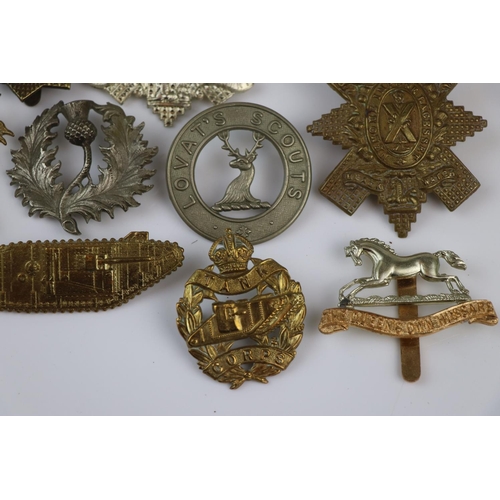 81 - A Collection Of Approx Twenty Five British Military Regimental Cap Badges To Include : The Tank Corp... 