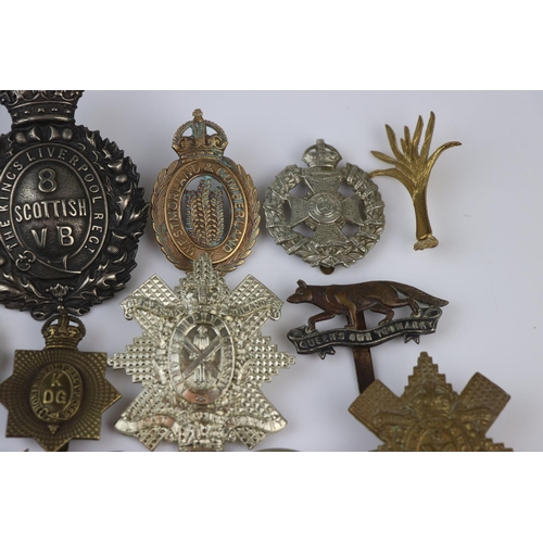 81 - A Collection Of Approx Twenty Five British Military Regimental Cap Badges To Include : The Tank Corp... 