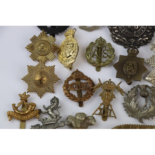 81 - A Collection Of Approx Twenty Five British Military Regimental Cap Badges To Include : The Tank Corp... 