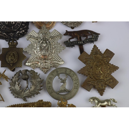 81 - A Collection Of Approx Twenty Five British Military Regimental Cap Badges To Include : The Tank Corp... 