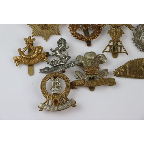 81 - A Collection Of Approx Twenty Five British Military Regimental Cap Badges To Include : The Tank Corp... 