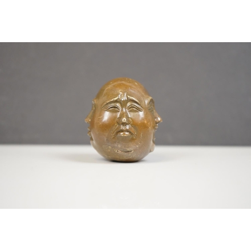 174 - A small bronze four faced Buddha paper weight character marks to underside.
