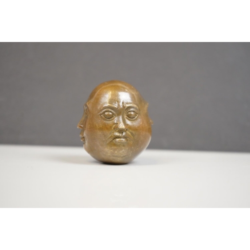 174 - A small bronze four faced Buddha paper weight character marks to underside.