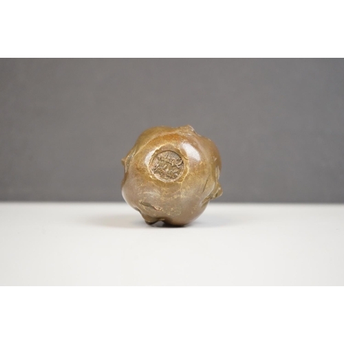 174 - A small bronze four faced Buddha paper weight character marks to underside.