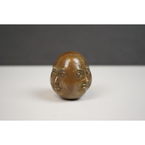 174 - A small bronze four faced Buddha paper weight character marks to underside.