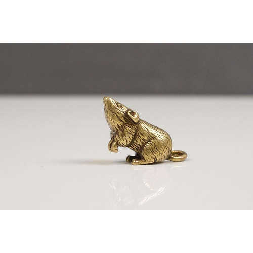 176 - A small brass figure of a mouse or rat.