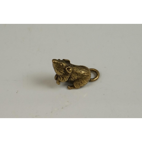 176 - A small brass figure of a mouse or rat.