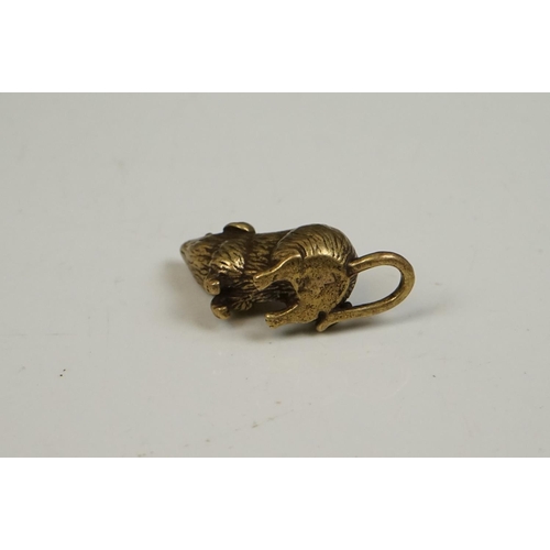 176 - A small brass figure of a mouse or rat.