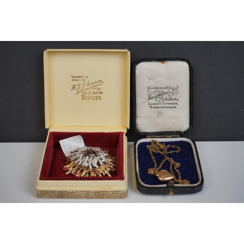 298 - A vintage starburst brooch together with a heart pendant.