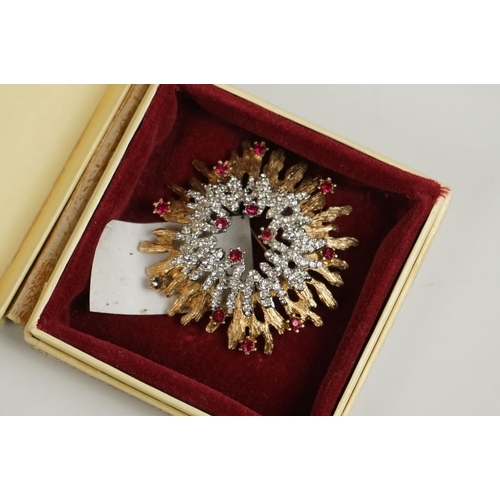 298 - A vintage starburst brooch together with a heart pendant.