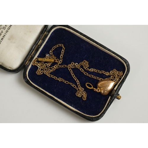 298 - A vintage starburst brooch together with a heart pendant.