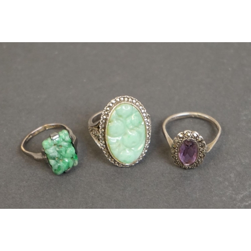 305 - Three silver rings comprising circa 1920s jade ring, a jade and marcasite dress ring, together with ... 