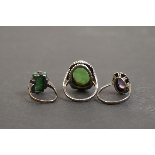 305 - Three silver rings comprising circa 1920s jade ring, a jade and marcasite dress ring, together with ... 