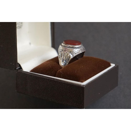 318 - Gentleman's Silver Ring set with an Oval Carnelian together with a Sterling Silver Brooch in the for... 