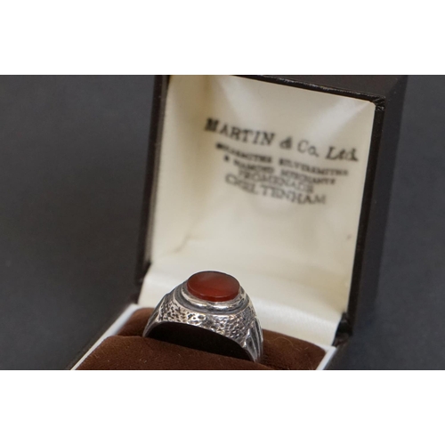 318 - Gentleman's Silver Ring set with an Oval Carnelian together with a Sterling Silver Brooch in the for... 
