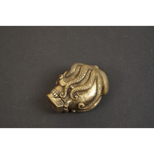 319 - Brass vesta case with skull and octopus