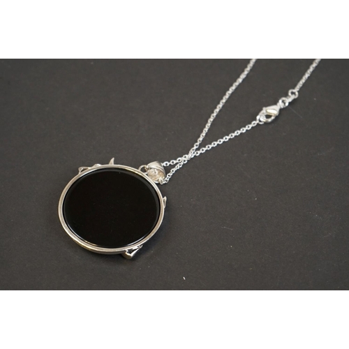 321 - Silver pendant necklace of dog form with ruby eye