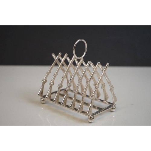 339 - Silver plated rifle style toast rack on bun feet