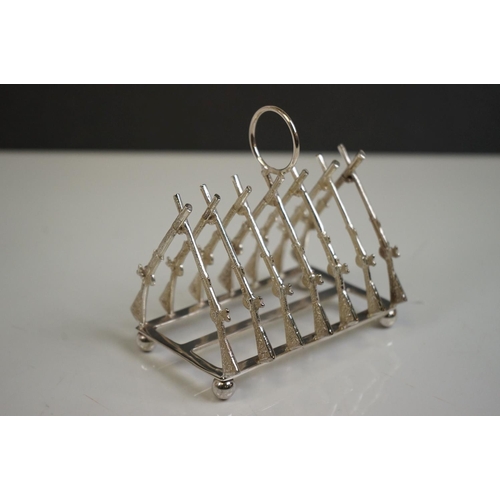 339 - Silver plated rifle style toast rack on bun feet