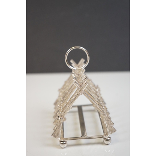339 - Silver plated rifle style toast rack on bun feet
