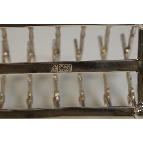 339 - Silver plated rifle style toast rack on bun feet