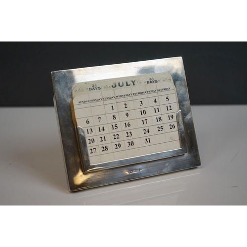 340 - A hallmarked sterling silver perpetual calendar by Walker & Hall.