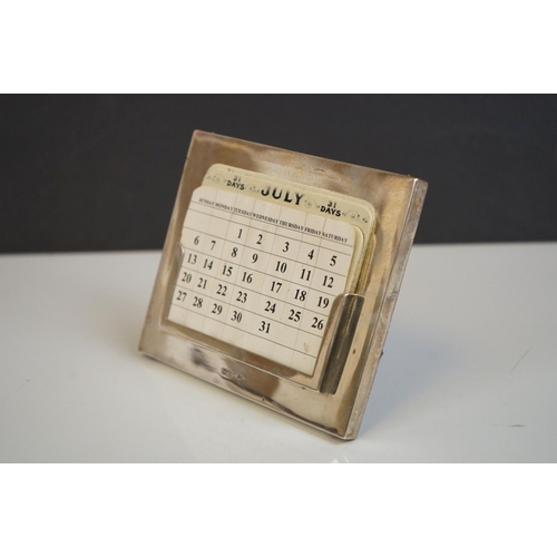 340 - A hallmarked sterling silver perpetual calendar by Walker & Hall.