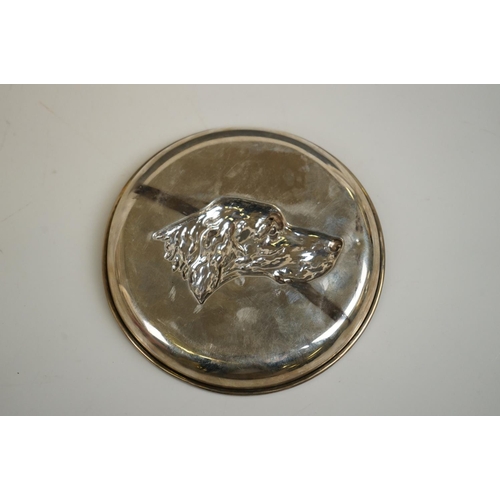 343 - A silver pin tray with hounds head decoration, by John Rose, Birmingham, 1908, 13cm diameter