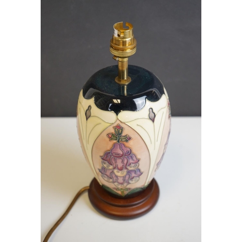 161 - Moorcroft Tube Lined Table Lamp with a Foxglove pattern, with silk shade, lamp 21cms high