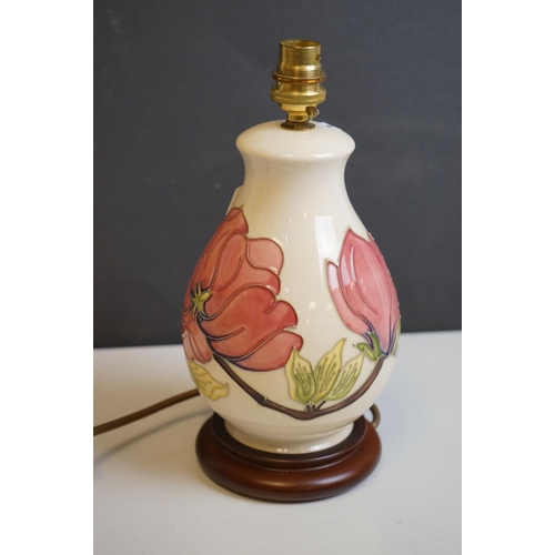 162 - Moorcroft Tube Lined Table Lamp in the Magnolia Patterm, with silk shade, lamp 23cms high