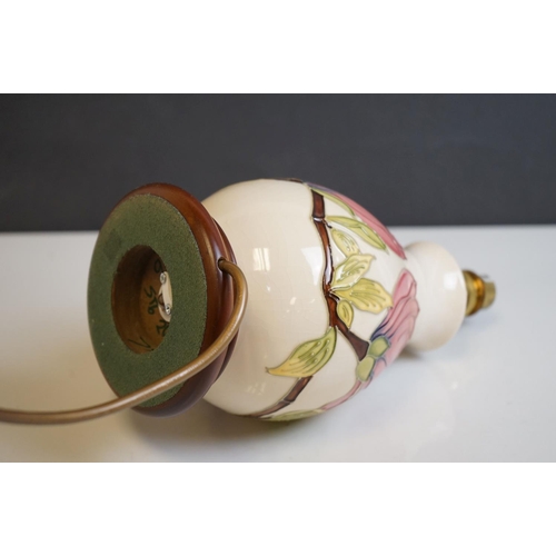 162 - Moorcroft Tube Lined Table Lamp in the Magnolia Patterm, with silk shade, lamp 23cms high