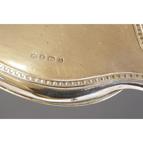 349 - A fully hallmarked sterling silver hand mirror together with two hallmarked silver topped scent bott... 