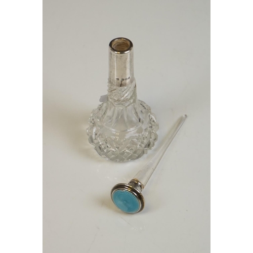 349 - A fully hallmarked sterling silver hand mirror together with two hallmarked silver topped scent bott... 