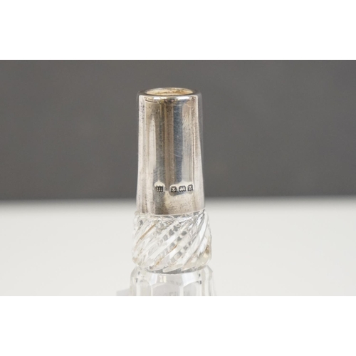 349 - A fully hallmarked sterling silver hand mirror together with two hallmarked silver topped scent bott... 