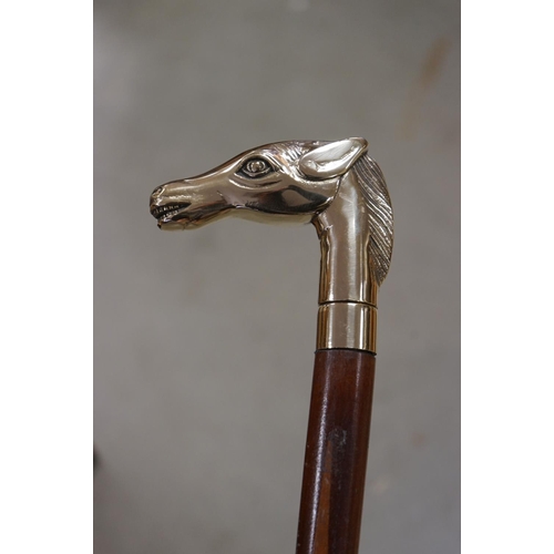 365 - Walking Stick with a Brass Handle in the form of a Horse Head together with another Walking Stick wi... 