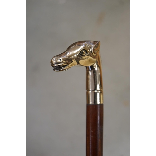 365 - Walking Stick with a Brass Handle in the form of a Horse Head together with another Walking Stick wi... 
