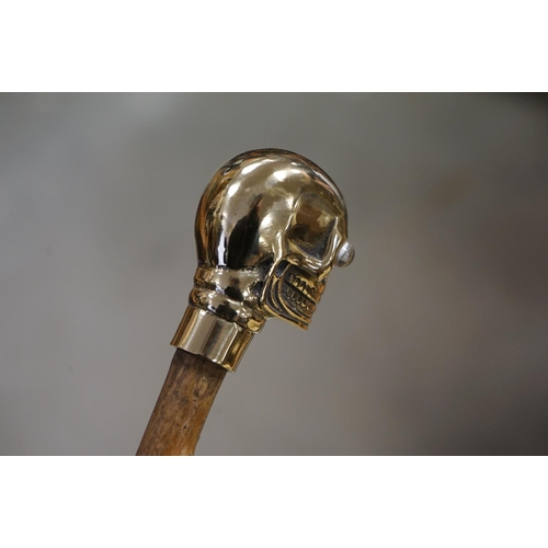 366 - Walking Stick with Brass Handle in the form of a Skull together with a Walking Stick with Antler Han... 